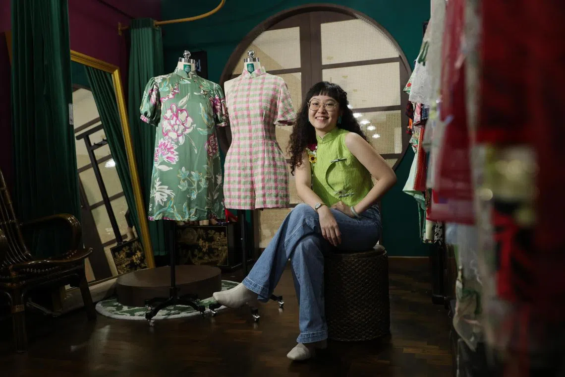 ST20240116_202480829981: Gin Tay/ sfcheongsam/ Chin Soo Fang/
Profile of founder of Studio HHFZ, Ms Hu Ruixian 30 with her collection of cheongsams for everyday wear at Studio HHFZ on Jan 16, 2024.

She wore a cheongsam top, and posed with a romper and a green breastfeeding-friendly dress, all suitable for everyday wear.