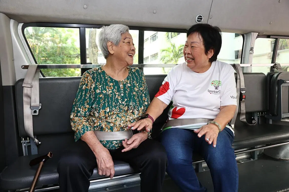 Patricia Lee (right) volunteers as a transport kaki at PCF Sparkle Care @ Yew Tee, supporting frail seniors on their medical appointments.