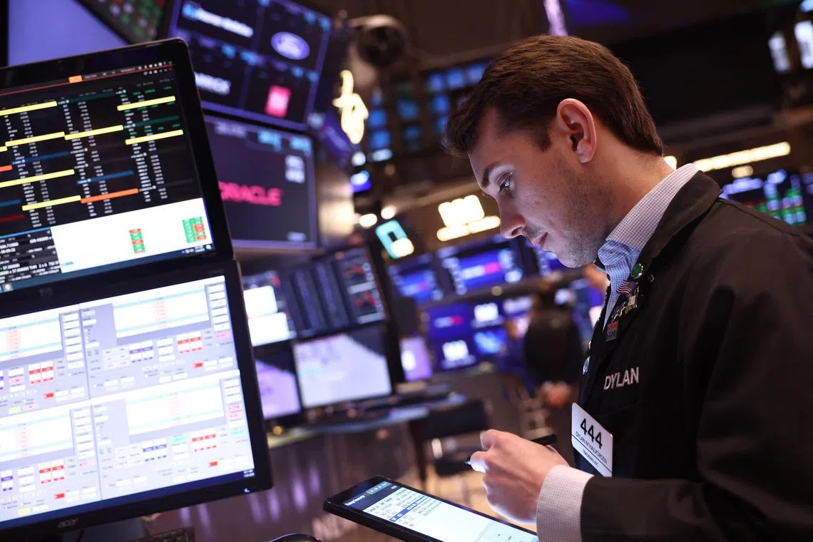 Traders work on the floor of the New York Stock Exchange during morning trading on January 24, 2025 in New York City. 