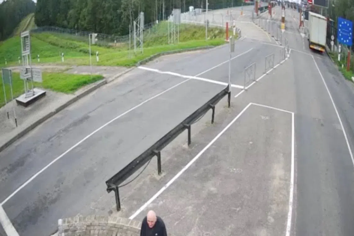 A man, believed to be Belarusian opposition politician Mikola Statkevich, who refused to cross into Lithuania with other freed prisoners after they were pardoned and released at the request of U.S. President Donald Trump on Thursday, a senior official in the exiled opposition told Reuters, sits in the no man's zone at the Belarus - Lithuania border crossing, September 11, 2025. State Border Committee of the Republic of Belarus/Handout via REUTERS/File Photo