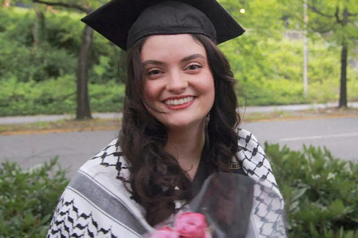 Turkish-American woman Aysenur Ezgi Eygi, a graduate of the University of Washington, poses wearing her mortarboard and keffiyeh in a family photograph taken at the University of Washington's 2024 commencement ceremony, in Seattle, Washington, U.S,  June 8, 2024. International Solidarity Movement/Handout via REUTERS/File Photo