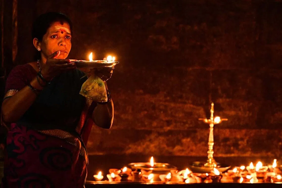 A devotee offering prayers on the occasion of the Thai Pongal festival at a Hindu temple in Colombo, Sri Lanka, on Jan 15, 2026. 