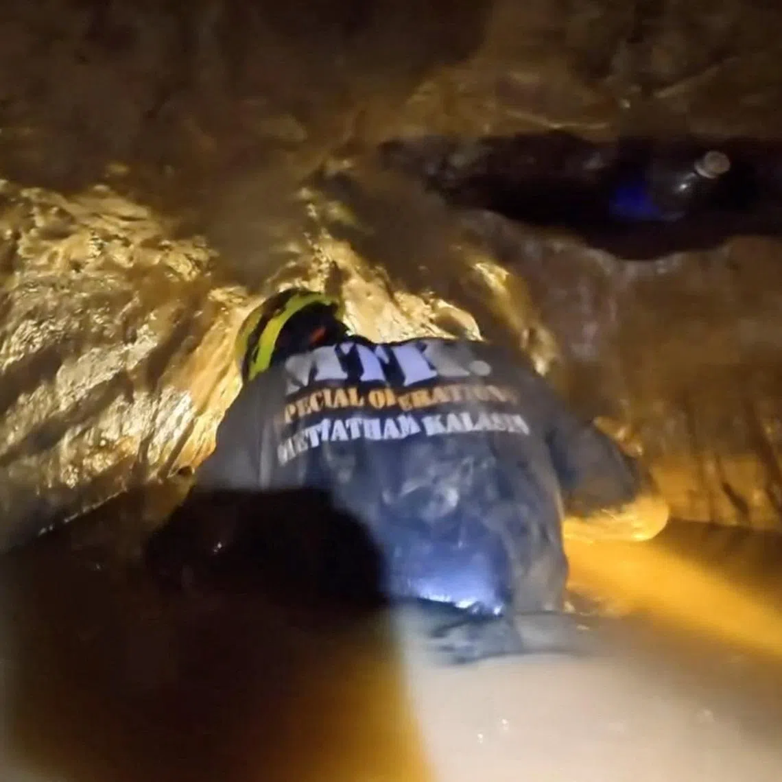 A rescuer working to save people trapped in a cave in Laos on May 25.