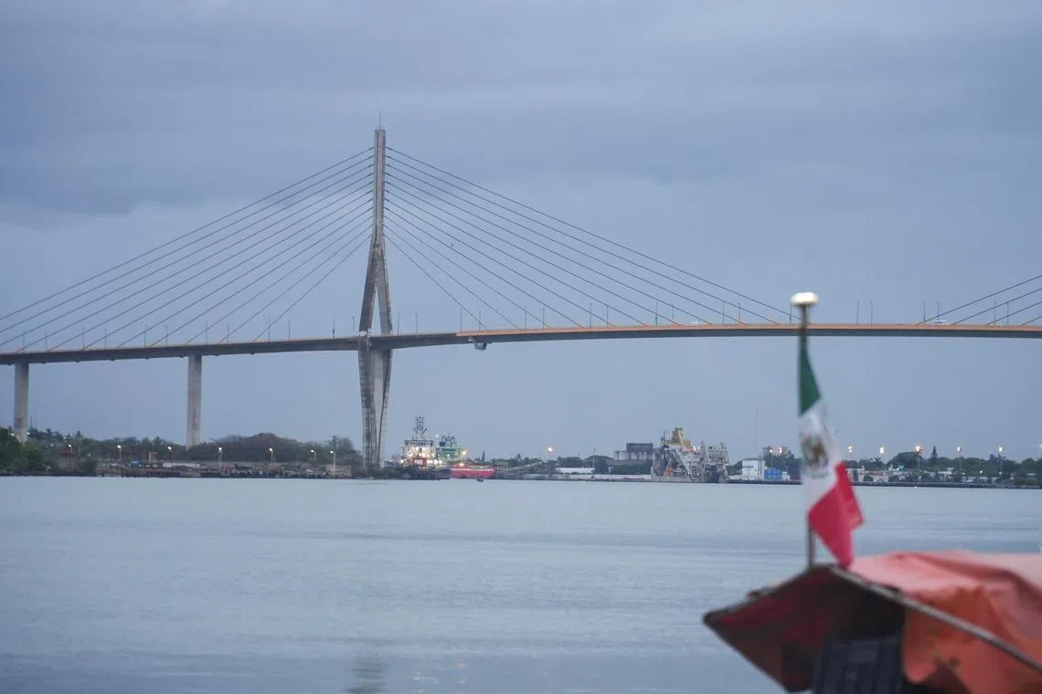 A view of dark clouds over the Tampico bridge, ahead of the impact of Tropical Storm Alberto, in Tampico, Mexico June 19, 2024. REUTERS/James Rodriguez