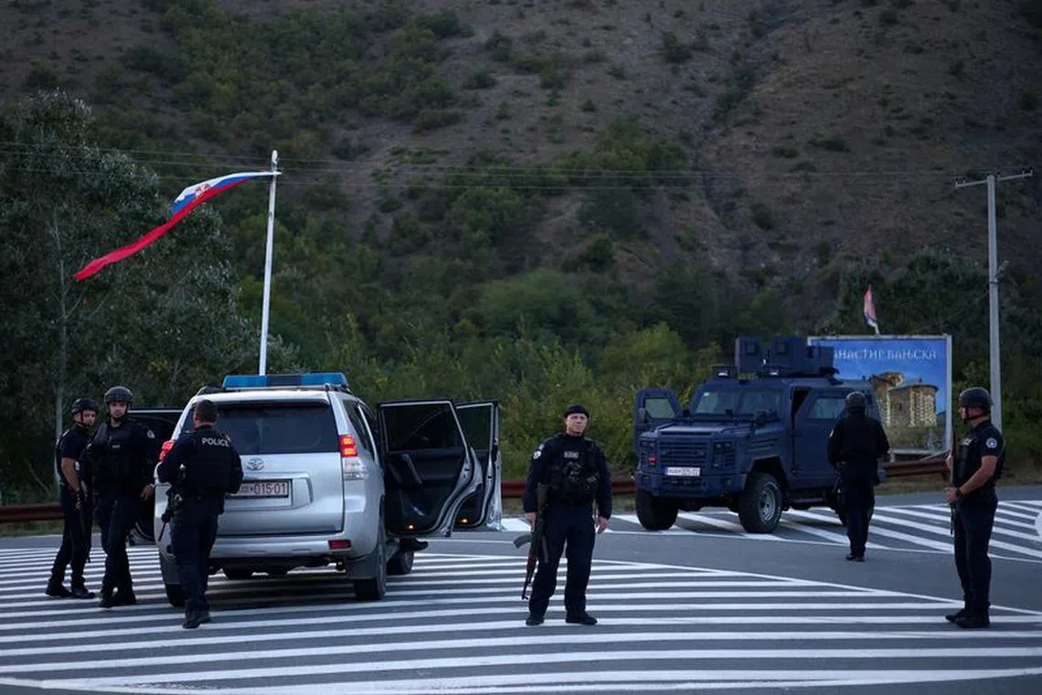 Kosovo special police officers patrol a road to Banjska monastery, in the aftermath of a shooting incident, near Zvecan, Kosovo September 26, 2023. REUTERS/Florion Goga