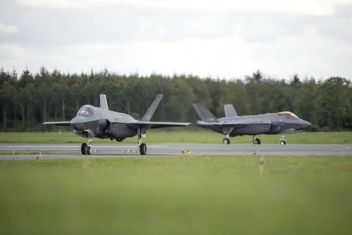 epa10860658 F-35 fighter jets arrive at Skrydstrup Air Force Base, in Skrydstrup, Denmark, 14 September 2023. The first four F-35 combat aircraft have arrived at the Royal Danish Air Force's base in Skrydstrup as part of the NATO member's plan to replace its current F-16 fleet with US-made planes.  EPA-EFE/Bo Amstrup DENMARK OUT