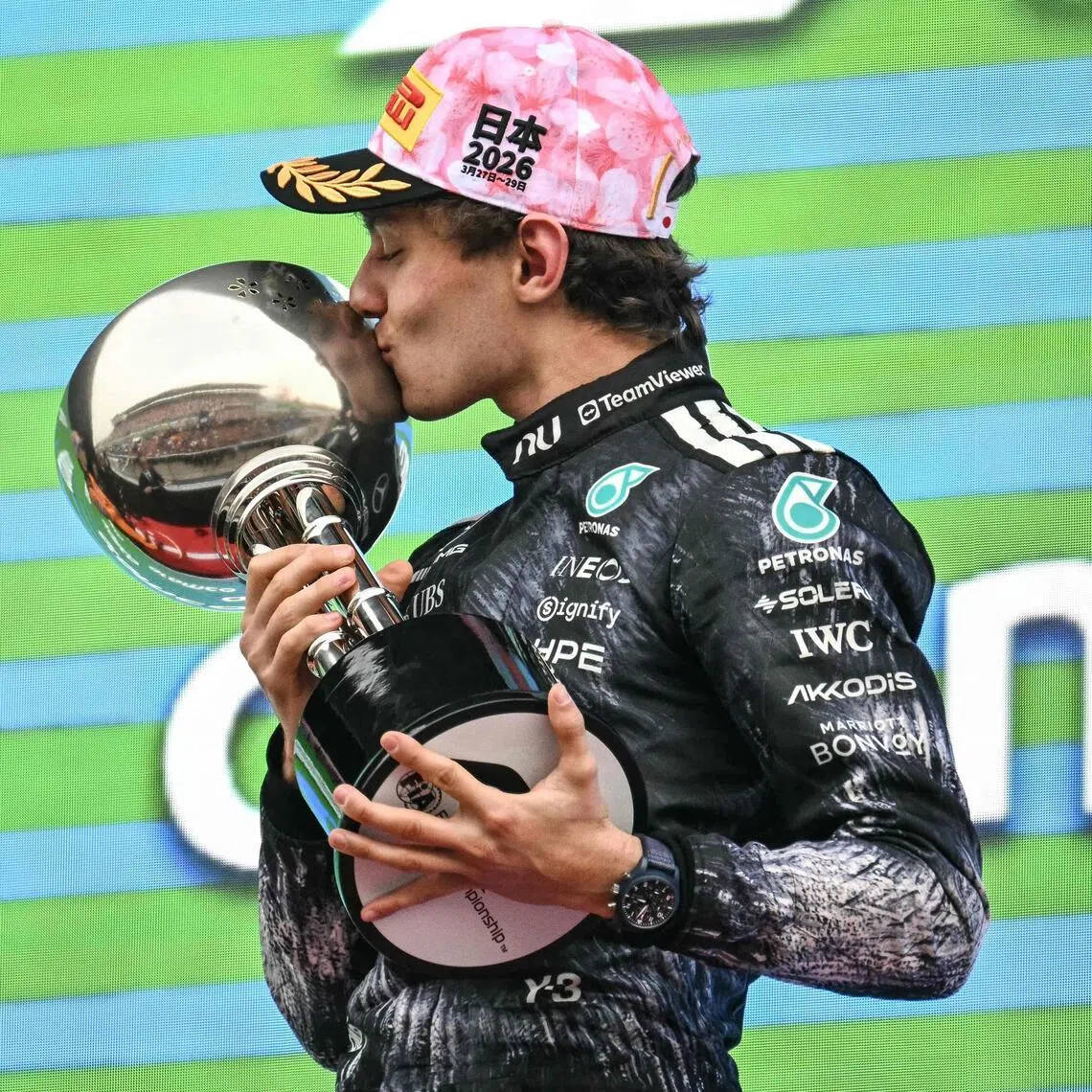 Mercedes' Italian driver Kimi Antonelli celebrates on the podium after the Formula One Japanese Grand Prix at the Suzuka circuit in March.