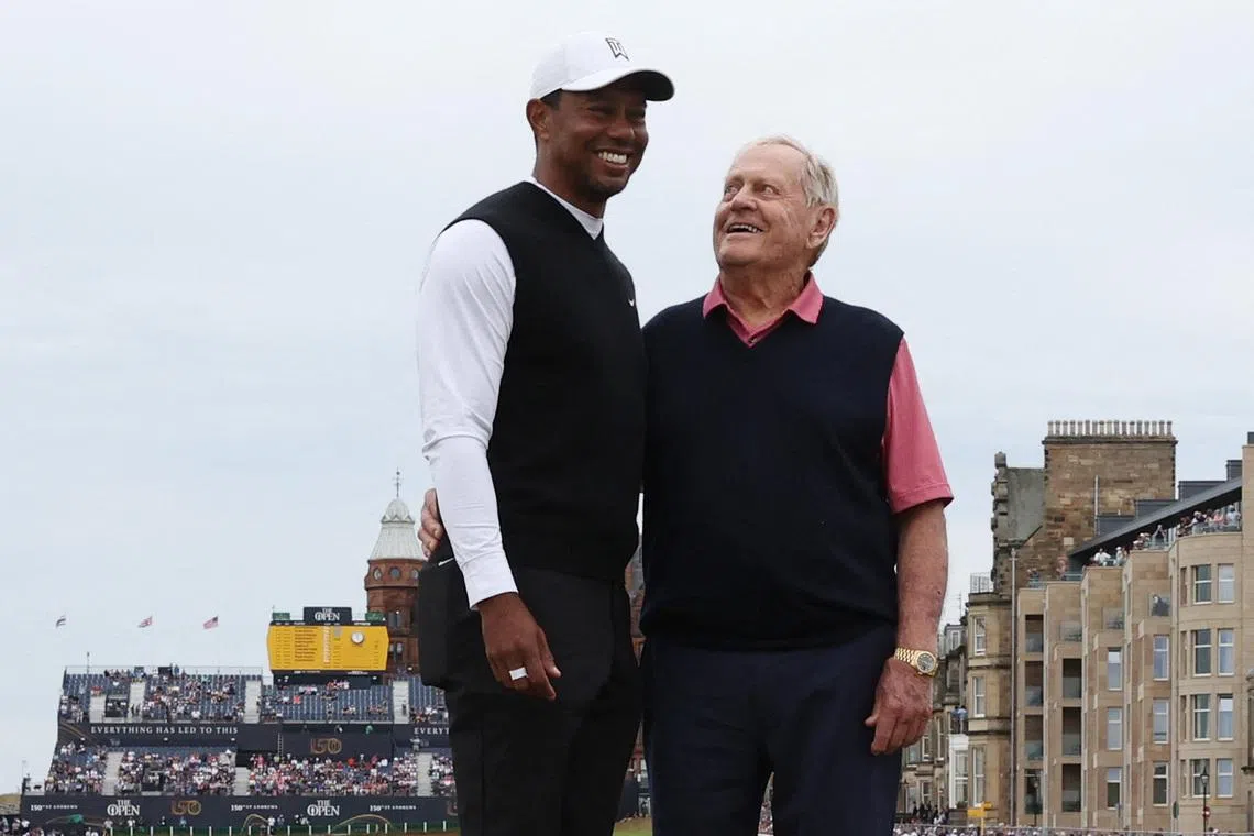 Golf - 150th Open Championship - St Andrews, Scotland, Britain - July 11, 2022 Former golfer Jack Nicklaus poses with Team Woods' Tiger Woods of the U.S. on the Swilcan Bridge during the Celebration of Champions four hole tournament REUTERS/Paul Childs