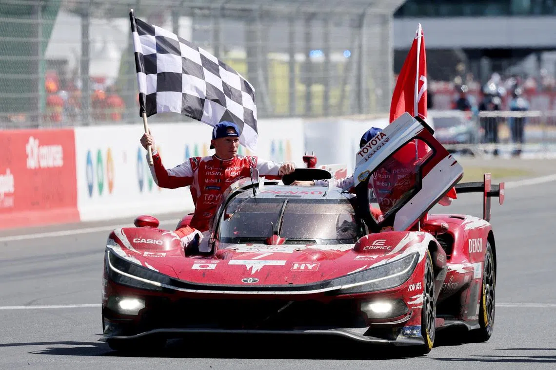 The 24 Hours of Le Mans - Circuit de la Sarthe, Le Mans, France - June 14, 2026 Toyota Racing's Mike Conway, Kamui Kobayashi, and Nyck de Vries celebrate after winning the 24 Hours of Le Mans REUTERS/Stephane Mahe