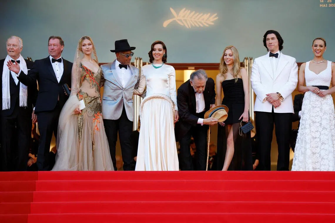 Director Francis Ford Coppola poses on the red carpet with cast members (from left) Jon Voight, DB Sweeney, Grace VanderWaal, Giancarlo Esposito, Aubrey Plaza, Romy Mars, Adam Driver and Nathalie Emmanuel, ahead of the screening of Megalopolis at the Cannes Film Festival.