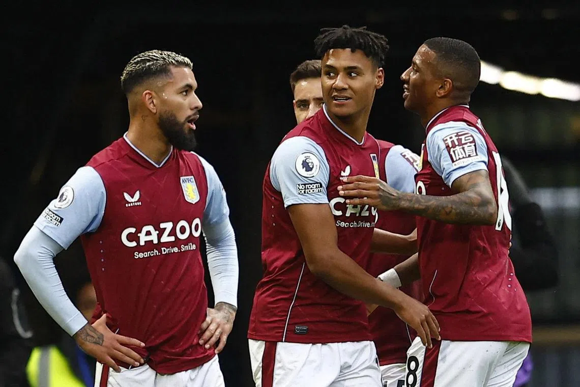 Aston Villa's Ollie Watkins celebrates scoring their first goal with Ashley Young and Douglas Luiz.