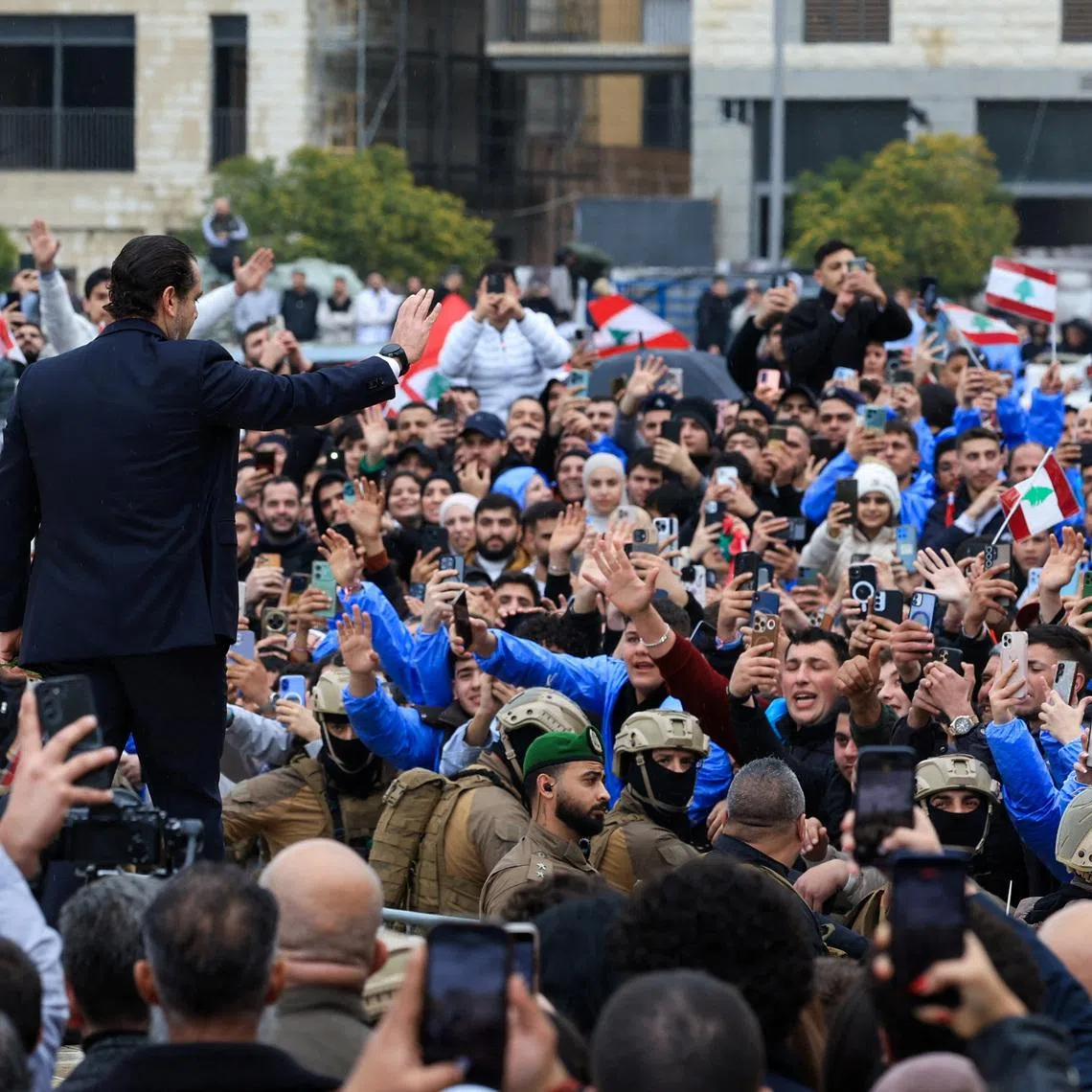 Saad Hariri gestures towards the gathered crowd during an event to mark the 21st anniversary of the assassination of his father and former Lebanese Prime Minister Rafik al-Hariri, in Beirut, Lebanon, February 14, 2026. REUTERS/Mohamed Azakir