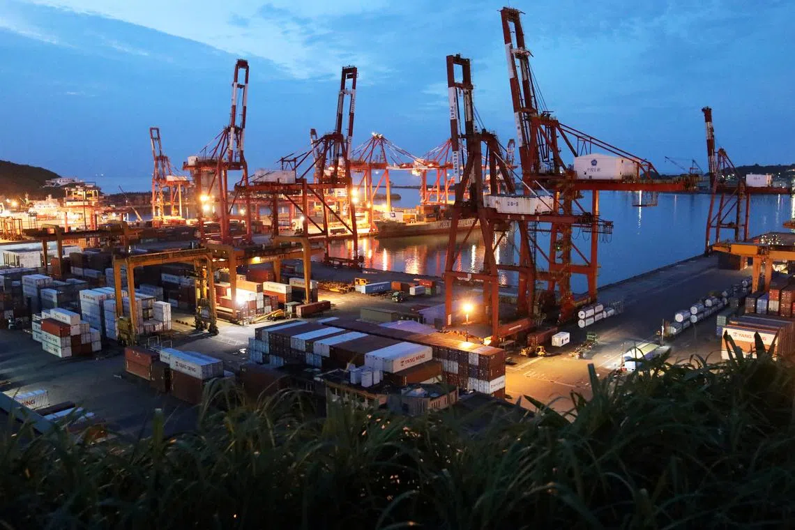 FILE PHOTO: A general view of a container terminal and the port during sunset in Keelung, Taiwan, June 10, 2020. REUTERS/Ann Wang/File Photo