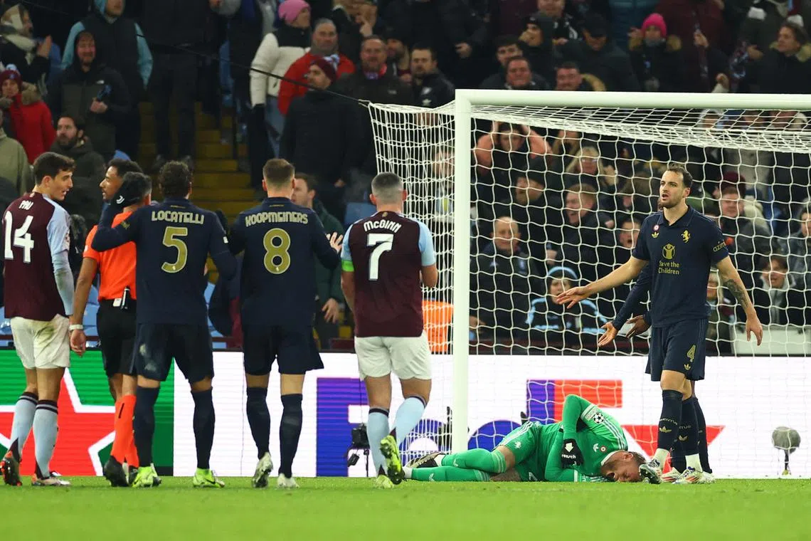 Juventus' Michele Di Gregorio reacts on the ground after Aston Villa's Morgan Rogers scores a goal in the final seconds of the match that was later disallowed.