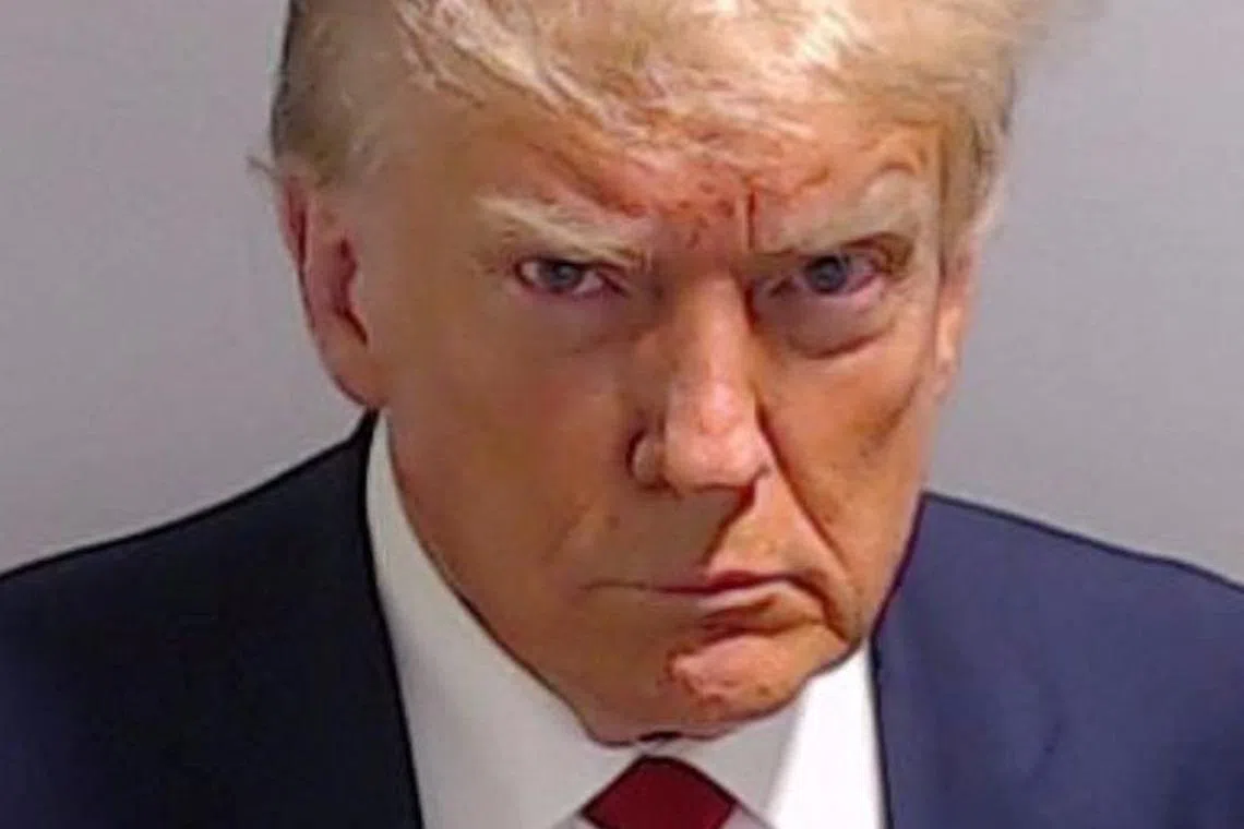 Former U.S. President Donald Trump is shown in a police booking mugshot released by the Fulton County Sheriff's Office, after a Grand Jury brought back indictments against him and 18 of his allies in their attempt to overturn the state's 2020 election results in Atlanta, Georgia, U.S., August 24, 2023. Fulton County Sheriff's Office/Handout via REUTERS