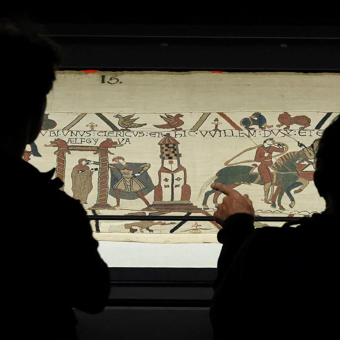 Visitors viewing the Bayeux Tapestry on Sept 10 as it goes on display to the public at the British Museum in London.