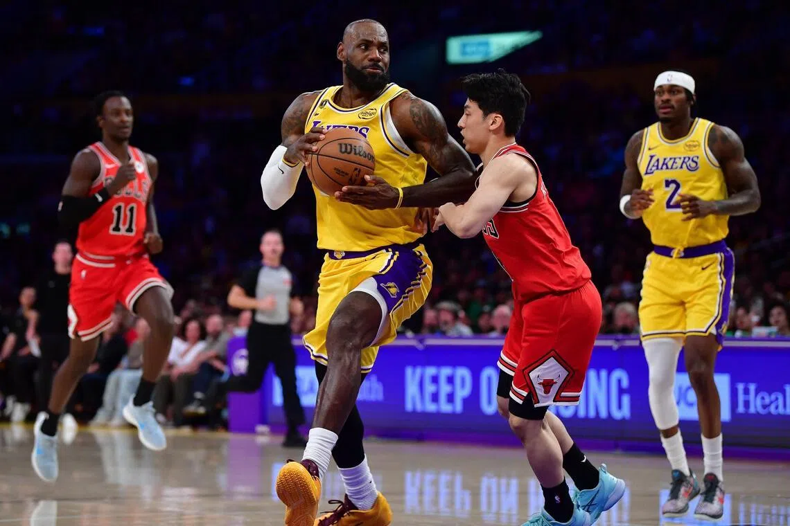 Los Angeles Lakers forward LeBron James drives to the basket against Chicago Bulls guard Yuki Kawamura during the first half at Crypto.com Arena.