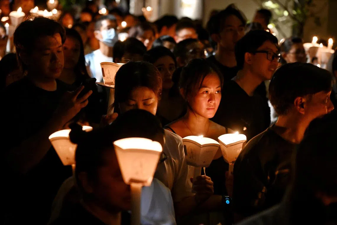 Worshippers at the candlelight procession during a remembrance service to mark Good Friday, the day Christians believe Jesus was crucified as a sacrifice to atone for mankind's sins, held at St. Joseph's Church at Victoria Street on March 29, 2024.