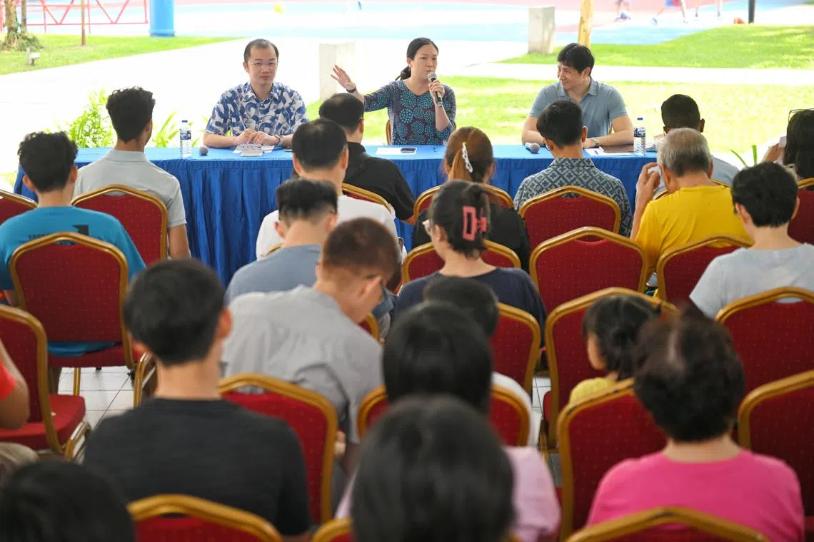 (From left) Sengkang GRC MPs Louis Chua, He Ting Ru and Jamus Lim at a town hall meeting with residents on March 29.