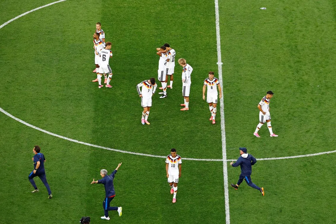 Soccer Football - FIFA World Cup 2026 - Round of 32 - Germany v Paraguay - Boston Stadium, Foxborough, Massachusetts, U.S. - June 29, 2026 Germany's Jamal Musiala with teammates look dejected after the match as Germany are eliminated from the World Cup REUTERS/Pilar Olivares
