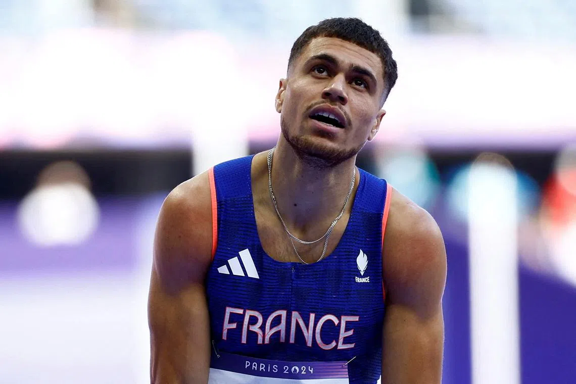 FILE PHOTO: Paris 2024 Olympics - Athletics - Men's 400m Hurdles Round 1 - Stade de France, Saint-Denis, France - August 05, 2024. Wilfried Happio of France reacts after finishing third in heat 4 REUTERS/Sarah Meyssonnier/File Photo