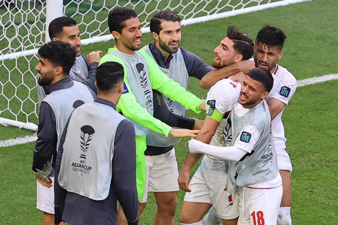 Iran's Alireza Jahanbakhsh celebrates scoring their second goal in the 2-1 Asian Cup quarter-final win over Japan.