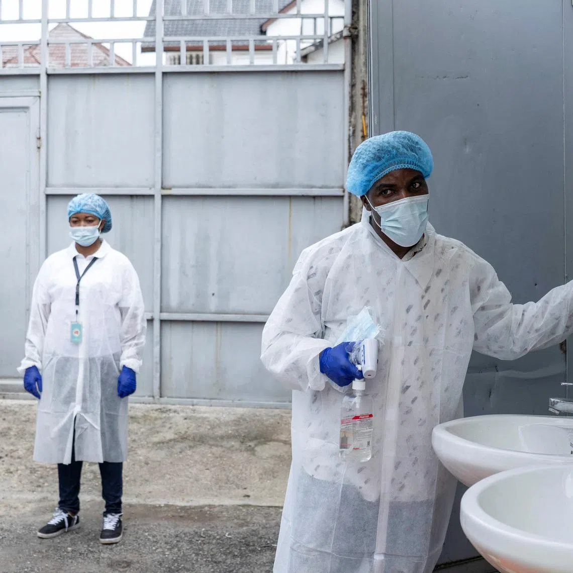 A Congolese health worker arranges a hand-washing station at the entrance to the Rodolphe Mérieux Laboratory, National Biomedical Research Institute (INRB), where samples from suspected Ebola cases are tested, as part of the response to the epidemic in Goma, North Kivu province of the Democratic Republic of Congo, May 19, 2026. REUTERS/Arlette Bashizi