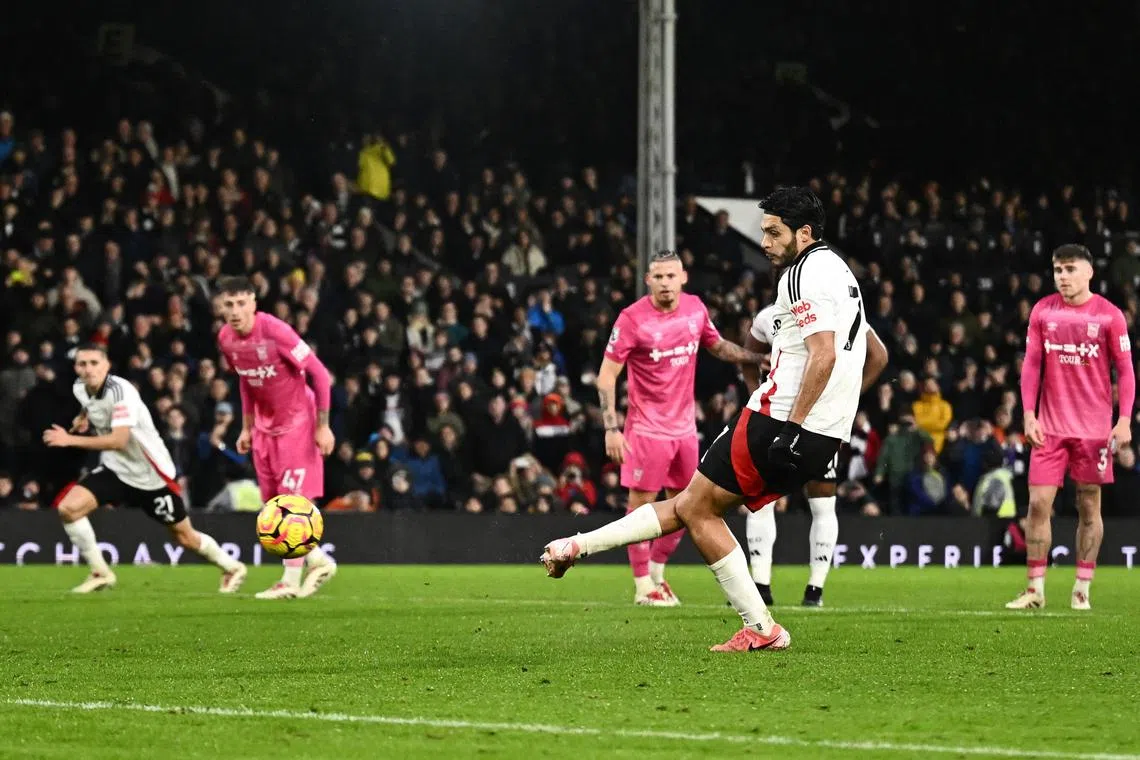 Soccer Football - Premier League - Fulham v Ipswich Town - Craven Cottage, London, Britain - January 5, 2025 Fulham's Raul Jimenez scores their second goal from the penalty spot REUTERS/Dylan Martinez