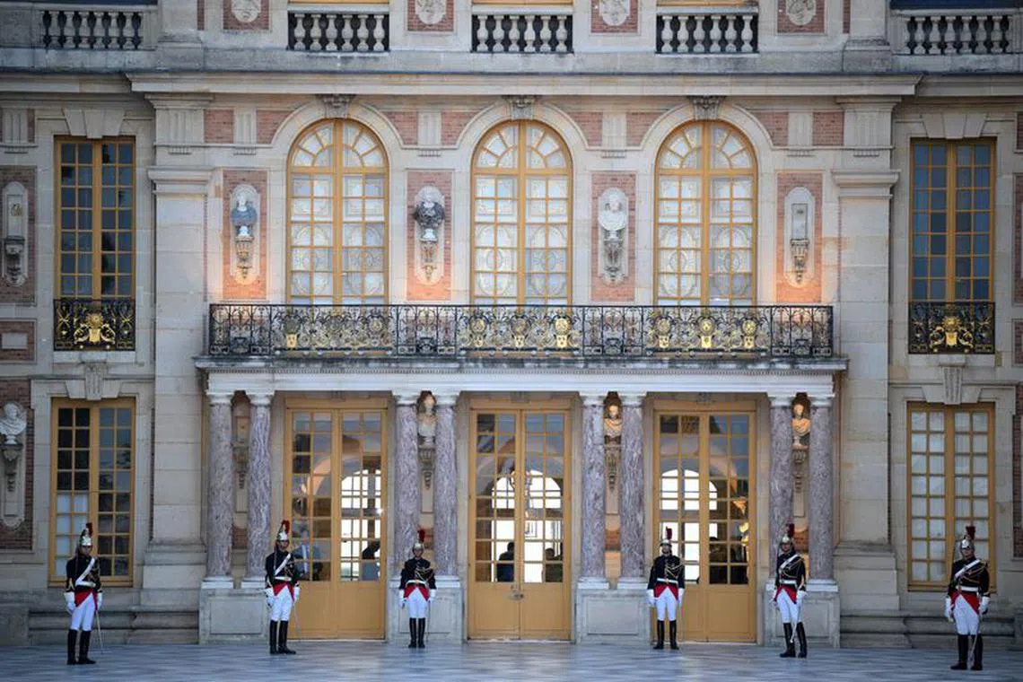 French Republican Guard stand to attention at the Palace of Versailles ahead of a state banquet, west of Paris, on September 20, 2023, on the first day of a British royal state visit to France. DANIEL LEAL/Pool via REUTERS/File Photo
