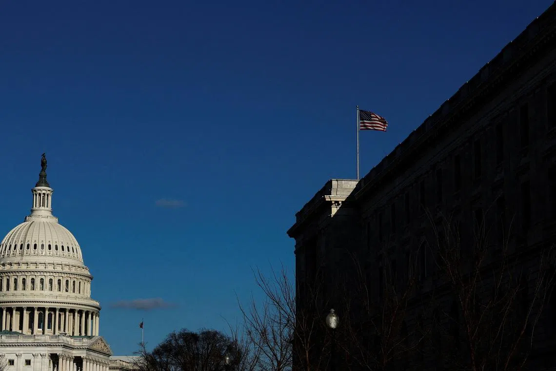 FILE PHOTO: The U.S. flag flies over the Cannon House Office Building on Capitol Hill in Washington, U.S. December 19, 2022.  REUTERS/Jonathan Ernst/File Photo