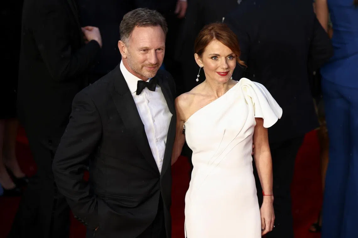 FILE PHOTO: Singer Geri Halliwell and her husband Red Bull team principal Christian Horner pose as they arrive at the world premiere of the new James Bond film \"No Time To Die\" at the Royal Albert Hall in London, Britain, September 28, 2021. REUTERS/Henry Nicholls/File Photo
