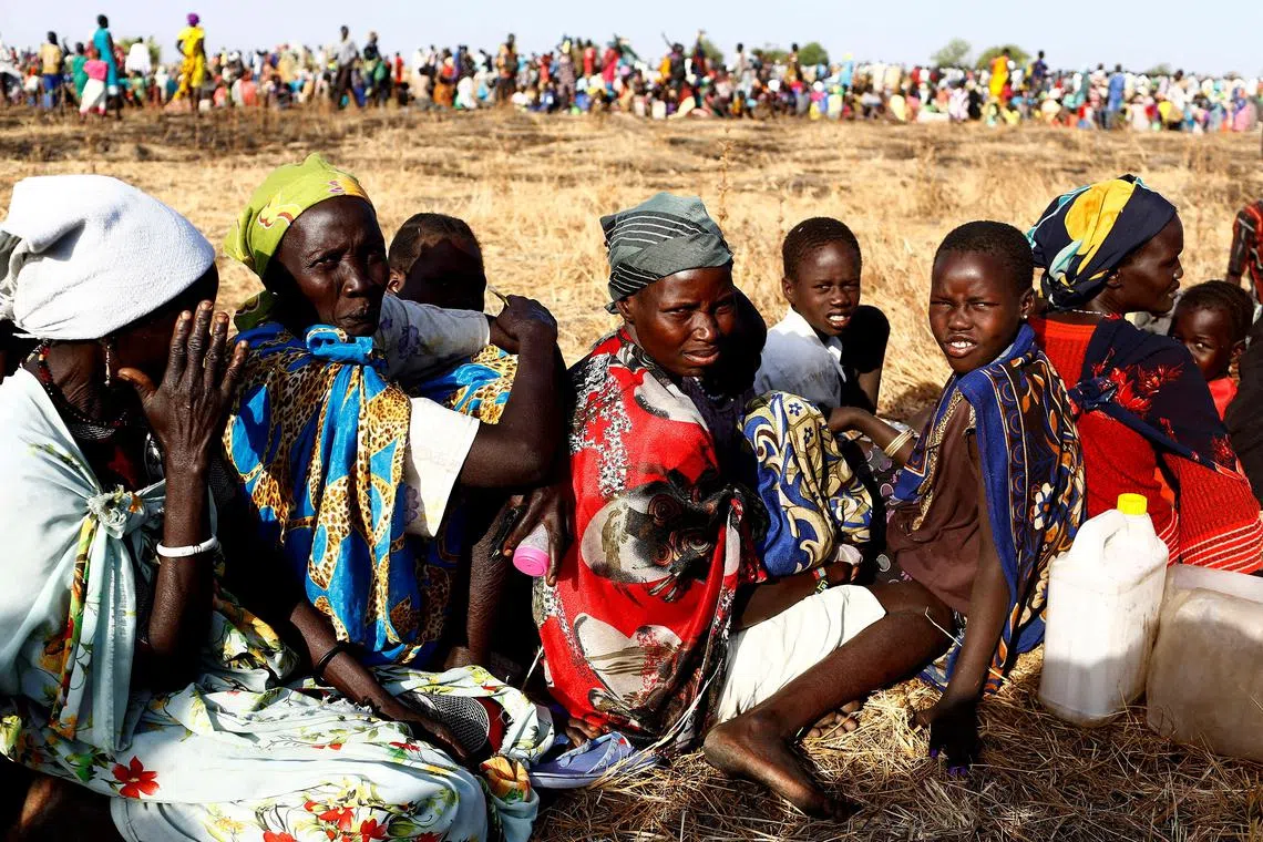 FILE PHOTO: Women and children wait to be registered prior to a food distribution carried out by the United Nations World Food Programme (WFP) in Thonyor, Leer state, South Sudan, February 25, 2017. REUTERS/Siegfried Modola/File Photo