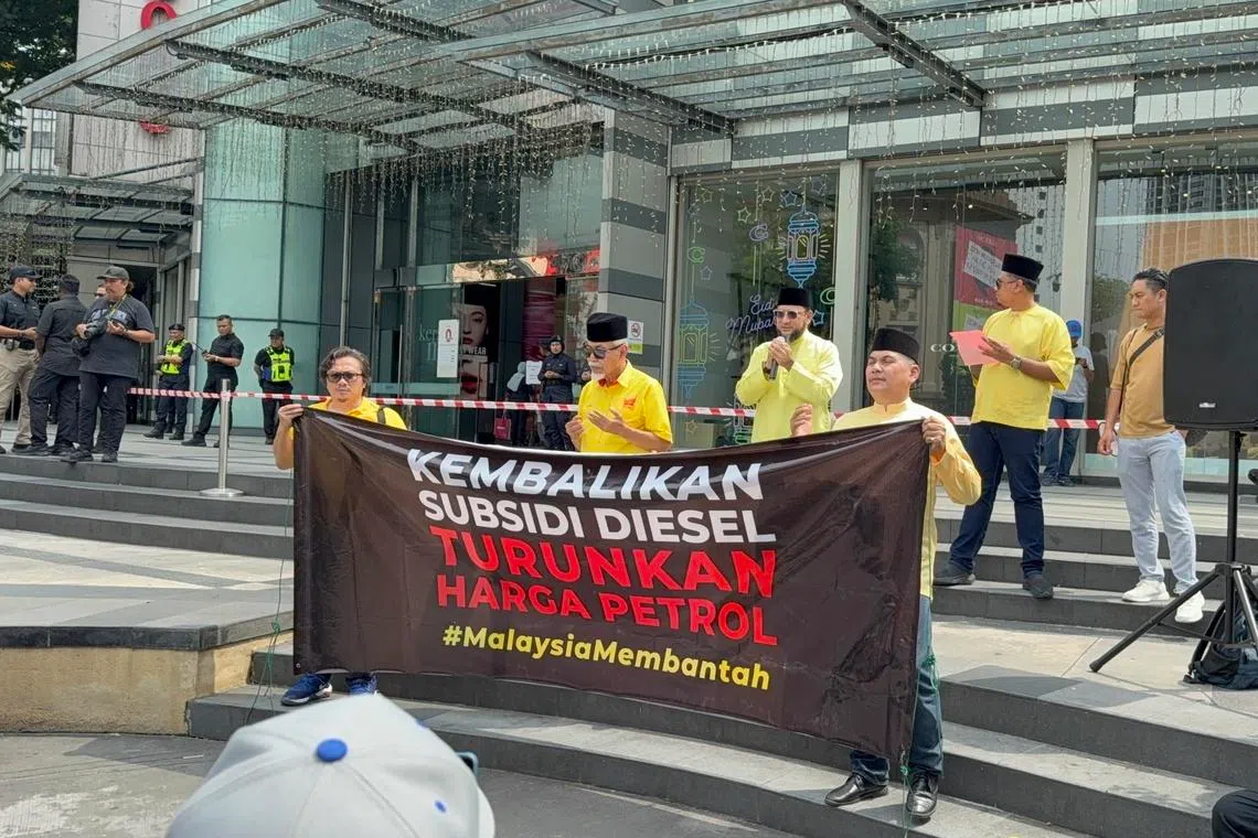 Protesters with a banner calling for diesel subsidies and cheaper petrol prices in Kuala Lumpur on April 5.