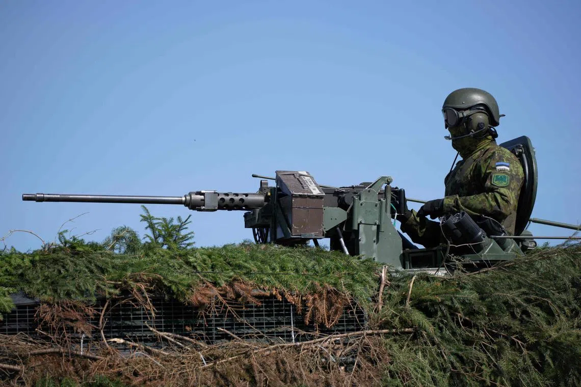 An Estonian soldier is seen in an infantry fighting vehicle during the Nato Spring Storm exercises on May 20, 2023.