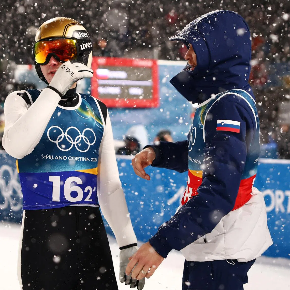 Milano Cortina 2026 Olympics - Ski Jumping - Men's Super Team - Predazzo Ski Jumping Stadium, Predazzo, Italy - February 16, 2026. Domen Prevc of Slovenia and Anze Lanisek of Slovenia during the final round REUTERS/Kacper Pempel