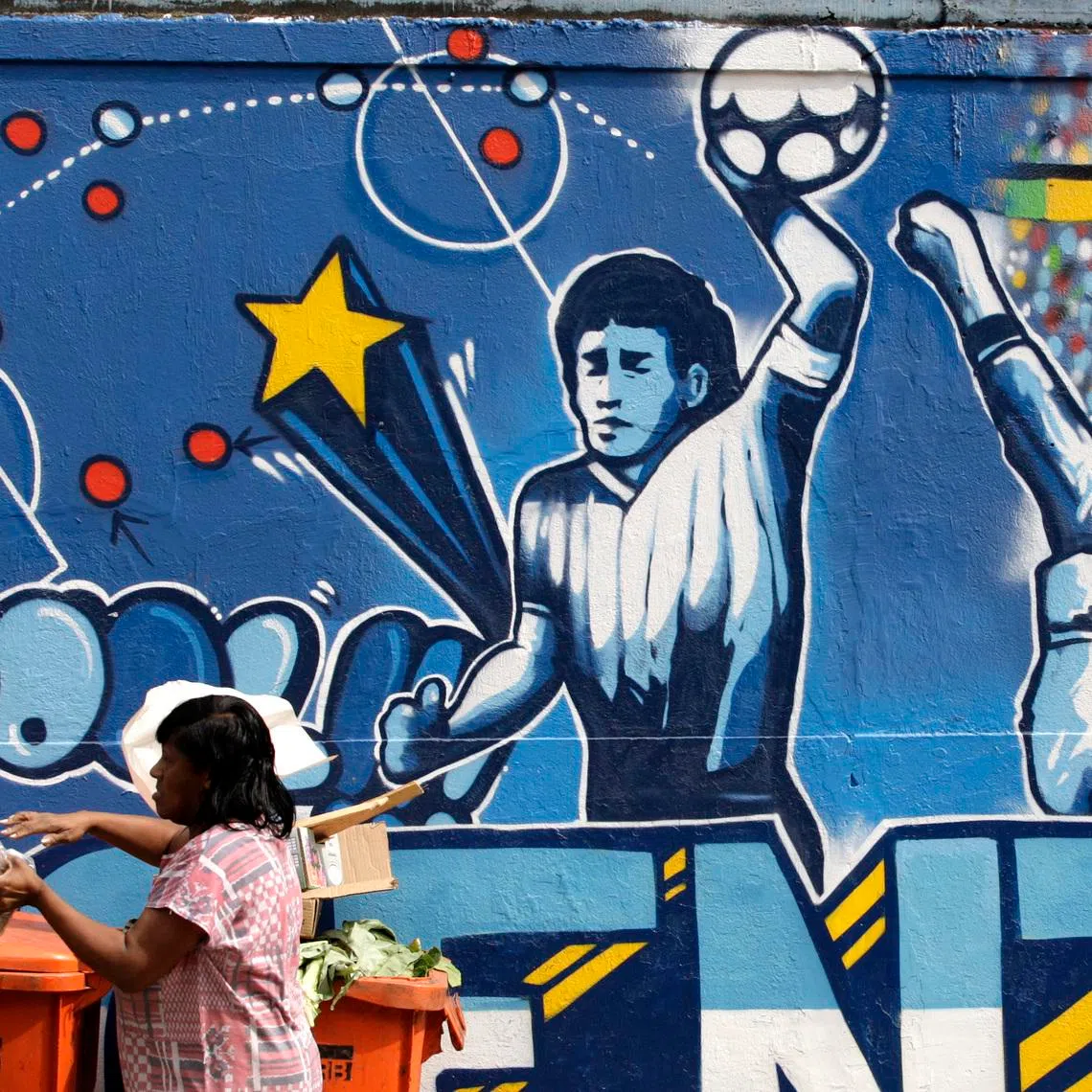 A mural depicting the famous “Hand of God” goal by former Argentine football star Diego Maradona in Rio de Janeiro.