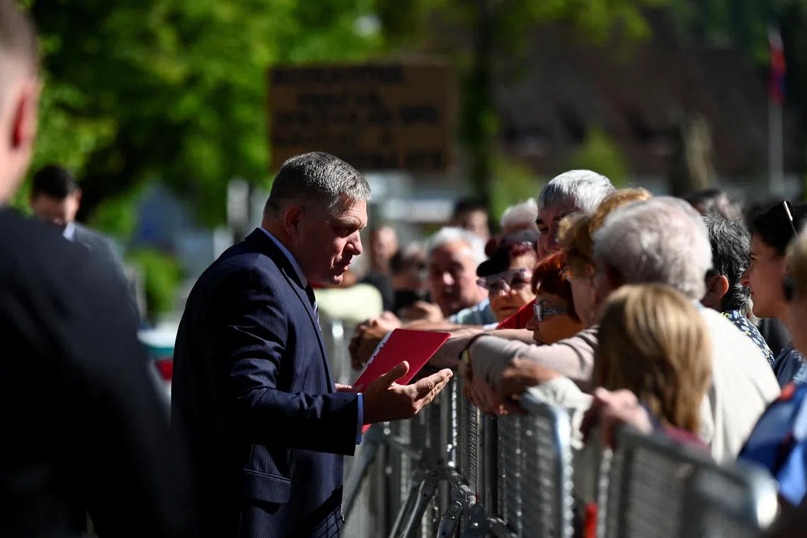 Slovak Prime Minister Robert Fico greeting people in Handlova, Slovakia, on May 15, before he was shot.