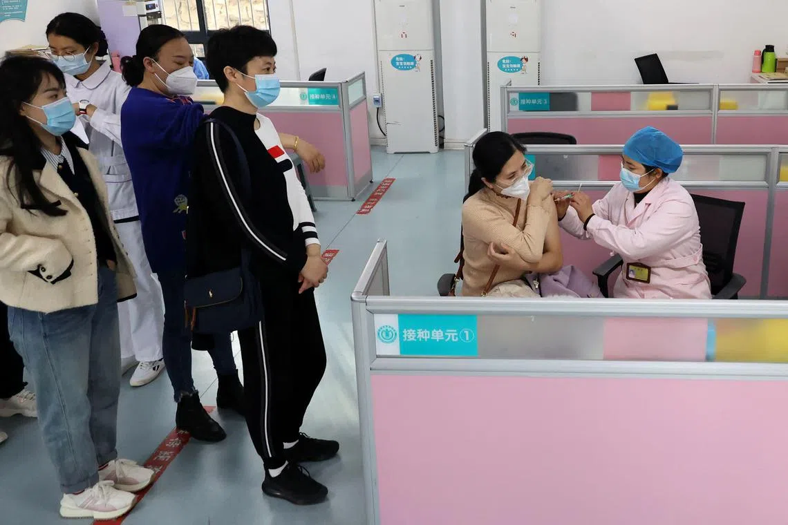A woman receives a flu vaccine at a health centre in Lianyungang, in China's eastern Jiangsu province on March 10, 2023. Influenza positivity rates at hospitals monitored by the Chinese Centre for Disease Control and Prevention in the week ending March 12 climbed to 53.2 per cent, about 13 times higher than a month earlier, latest data show.