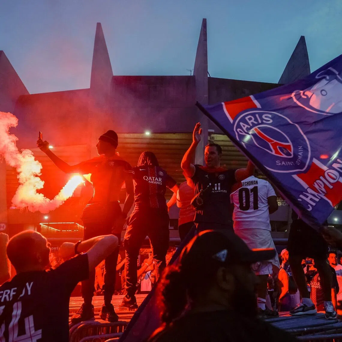PSG supporters in Paris celebrating their team's May 30 win in the UEFA Champions League final in Hungary against Arsenal, outside the Parc des Princes stadium.