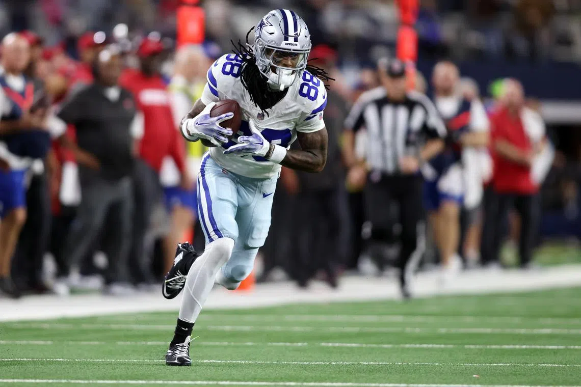 FILE PHOTO: Dec 22, 2024; Arlington, Texas, USA; Dallas Cowboys wide receiver CeeDee Lamb (88) runs after catching a pass against the Tampa Bay Buccaneers in the second quarter at AT&T Stadium. Mandatory Credit: Tim Heitman-Imagn Images/File photo
