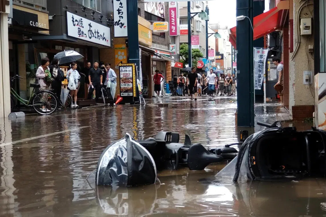 Torrential rain caused flooding in parts of Tokyo on Sept 11, with record downpours and strong winds.
