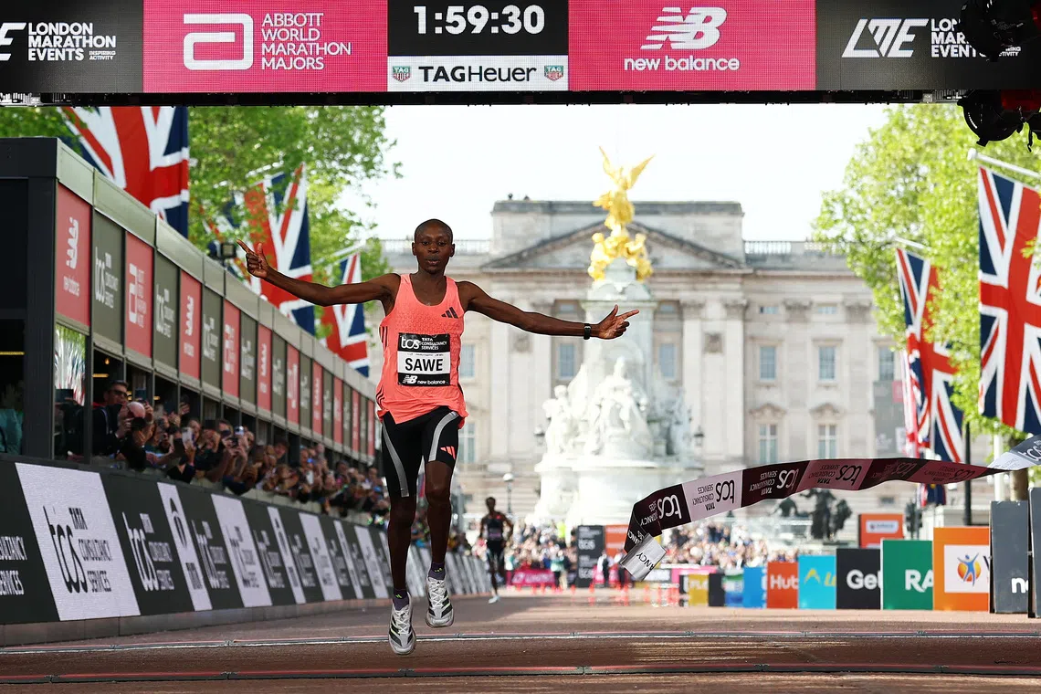 FILE PHOTO: Athletics - London Marathon - London, Britain - April 26, 2026 Kenya's Sabastian Sawe crosses the finish line to win the men's elite race REUTERS/Matthew Childs/File Photo