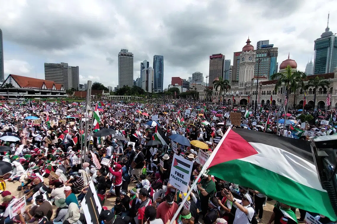azrally - Around 10,000 Malaysians gathered under the blazing hot sun to show their solidarity with Palestinians caught in the Israel-Hamas war.