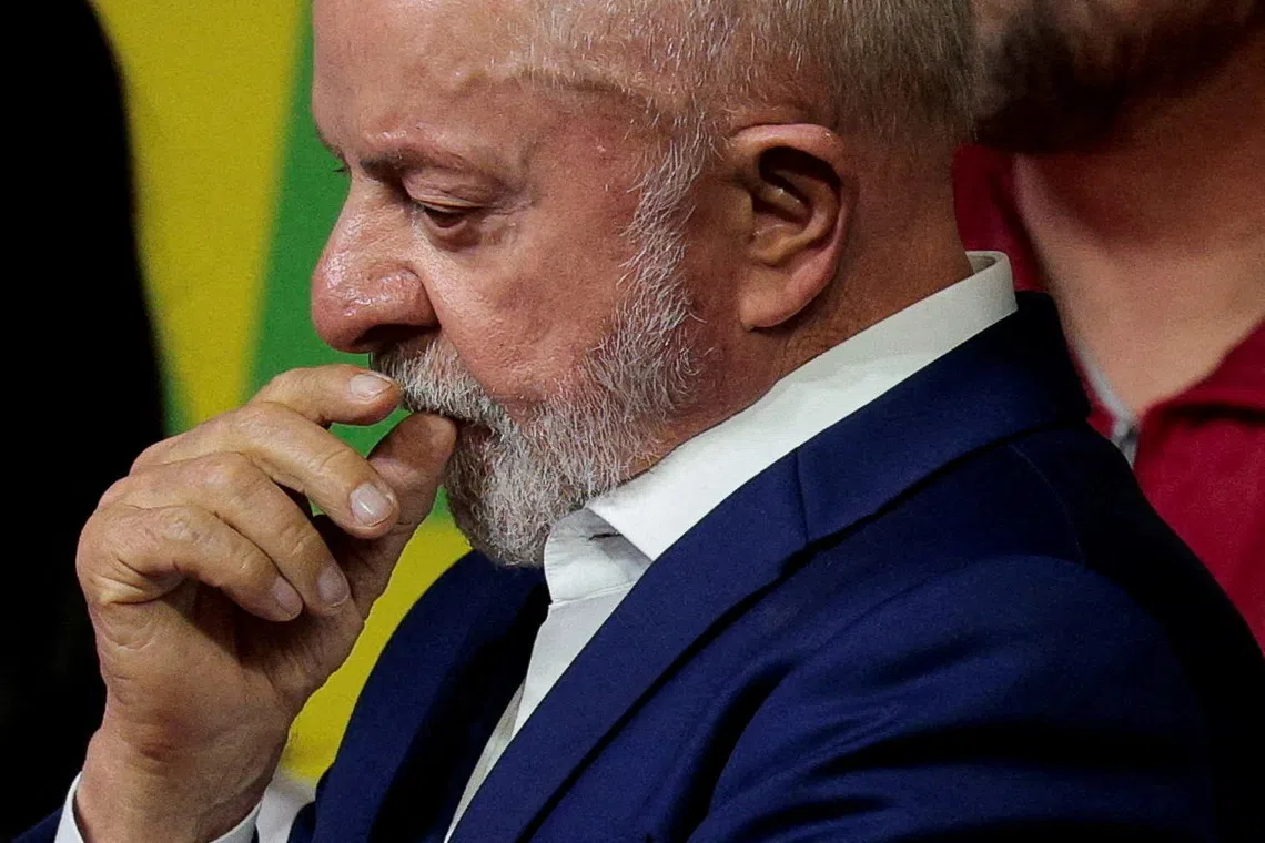 Brazilian President Luiz Inacio Lula da Silva, the Workers' Party (PT) candidate for presidential re-election, reacts during an address to supporters after the country's electoral authority said Liberal Party (PL)'s candidate Flavio Bolsonaro will face Lula in the runoff of a presidential election, in Sao Paulo, Brazil October 4, 2026. REUTERS/Brian Snyder
