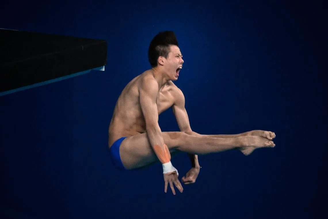 Full focus on the routine for China's Bai Yuming in the men's 10m platform event. The 16-year-old won the silver on Oct 4.