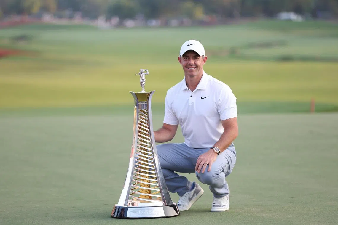 Rory McIlroy of Northern Ireland poses with his Race to Dubai trophy after the final round of DP World Tour Championship.