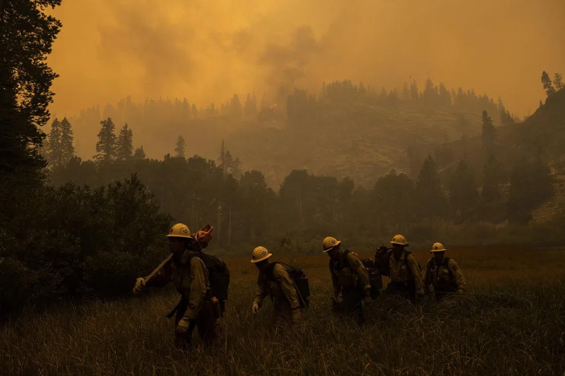  FILE Ñ Firefighters battling the Caldor Fire near Meyers, Calif. on Aug. 30, 2021. Technically, there is no safe level of particulate matter, and ever-spreading wildfire smoke driven by a changing climate and decades of forest mismanagement has reserved recent progress. (Max Whittaker/The New York Times)