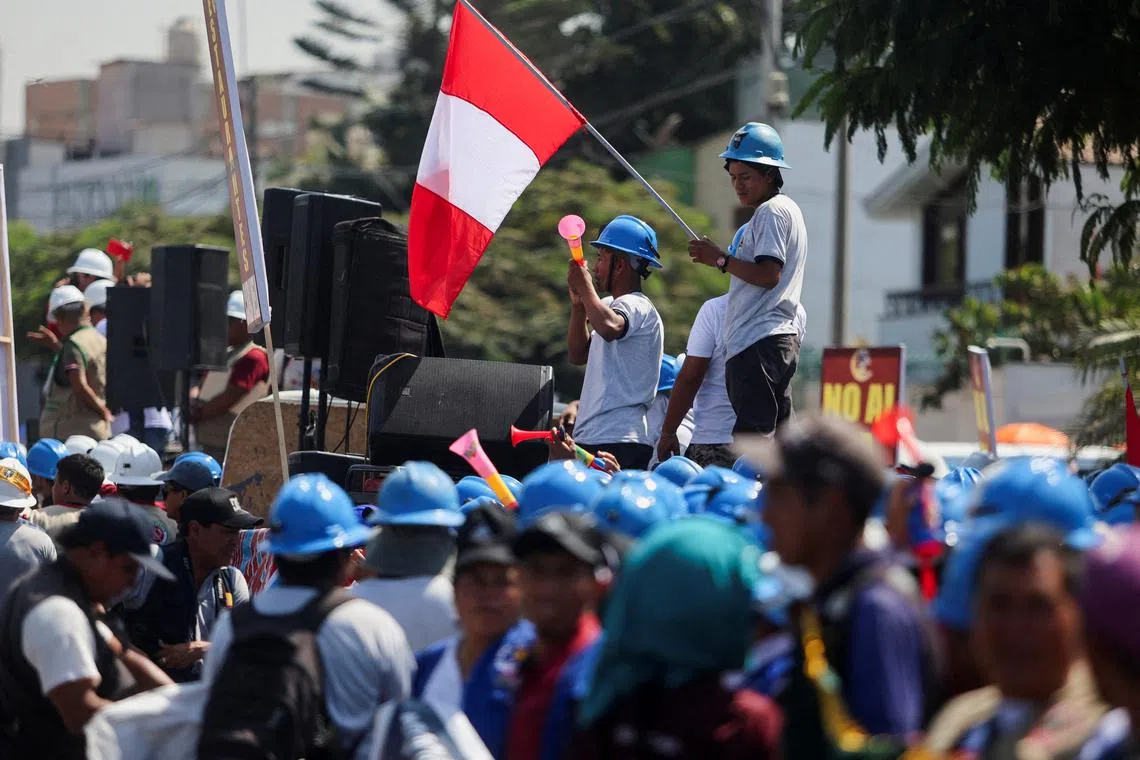 FILE PHOTO: Informal miners protest in front of the Ministry of Energy and Mines to demand the repeal of the law that prevents their formalization, in Lima, Peru, March 12, 2024. REUTERS/Sebastian Castaneda/File Photo