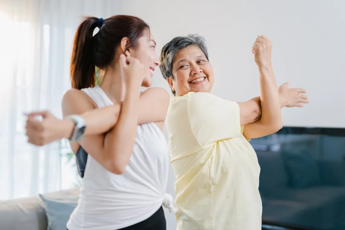 mother and daughter exercising