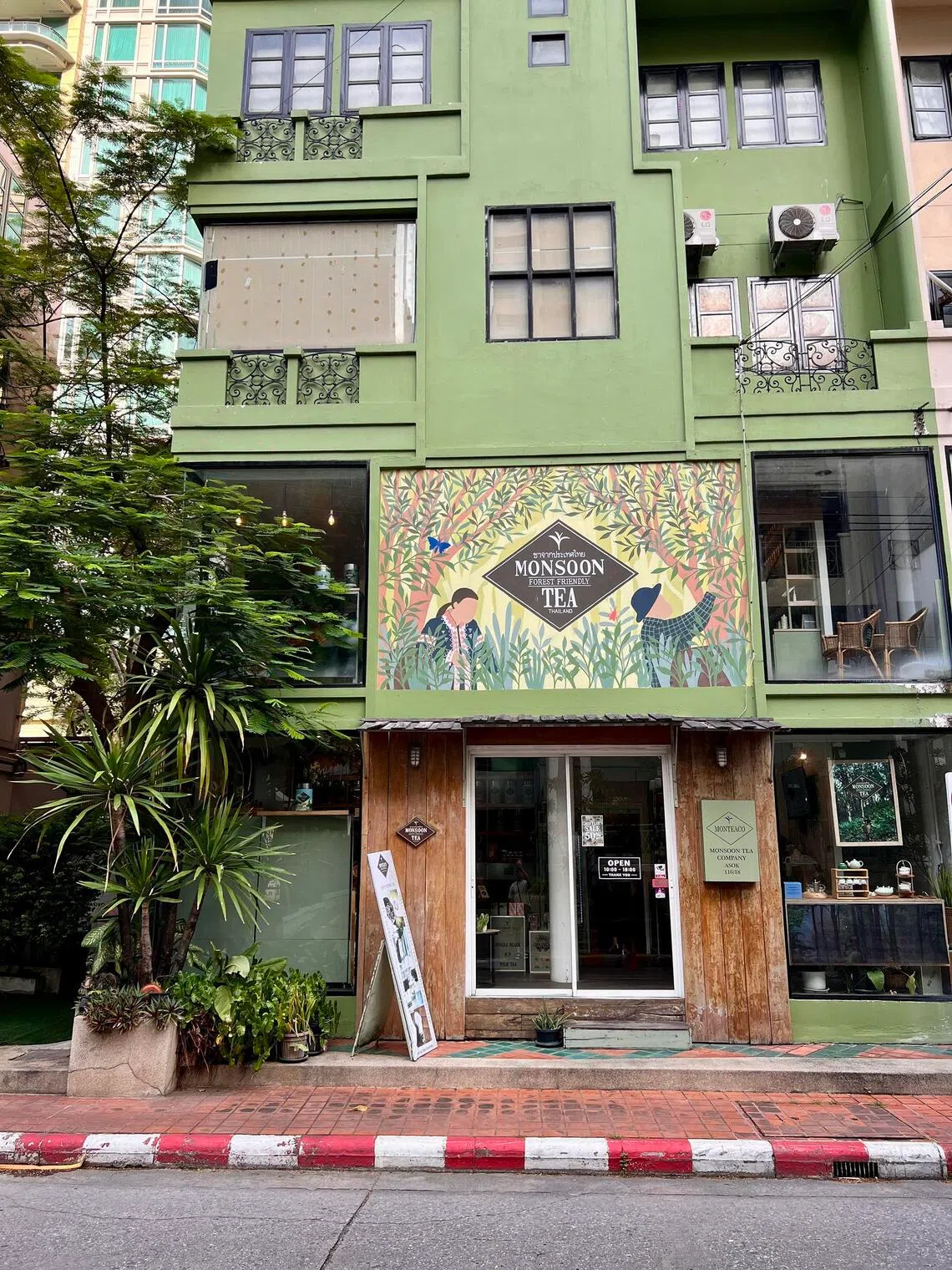 Monsoon Tea Company’s vibrant green teahouse in Asok, offering a welcoming change of pace from Bangkok’s frantic streets.